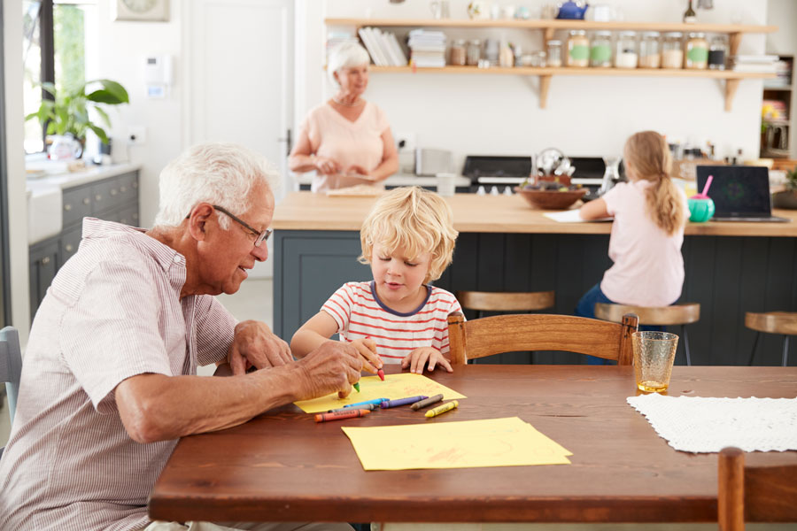 Grandparents sitting with grandchildren