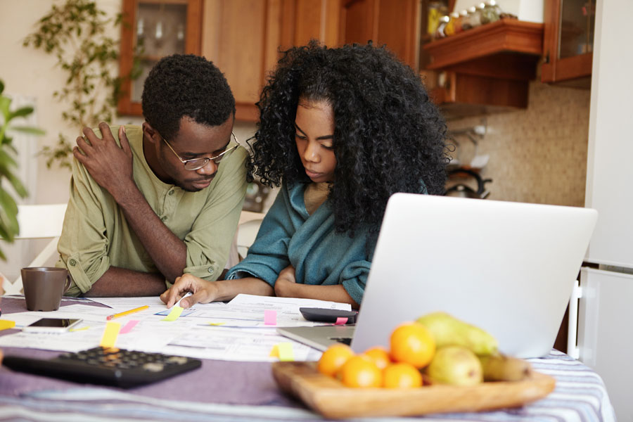 Young married couple looking at papers